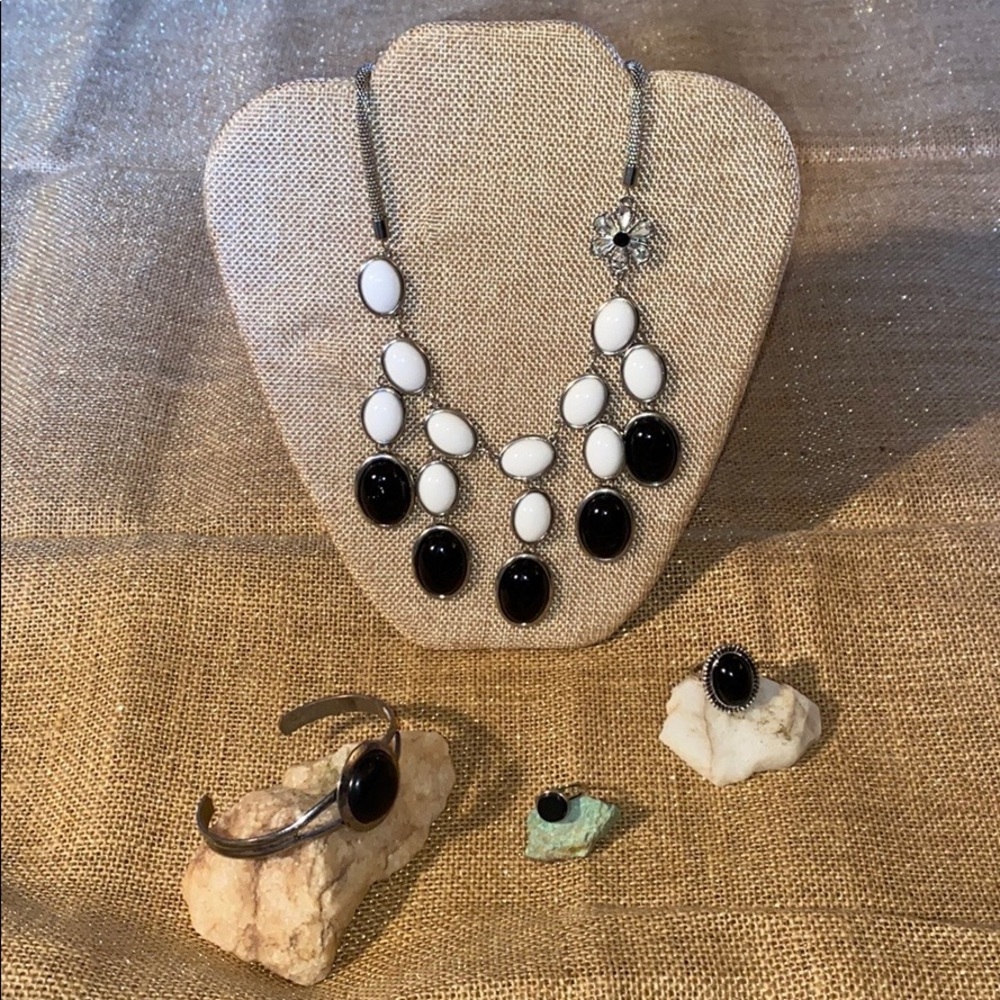 A necklace, bracelet and two rings